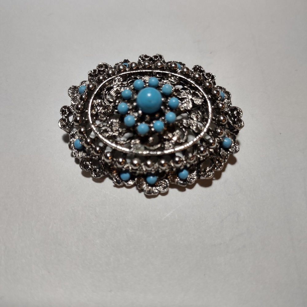 Intricate Silver and Blue Floral Brooch